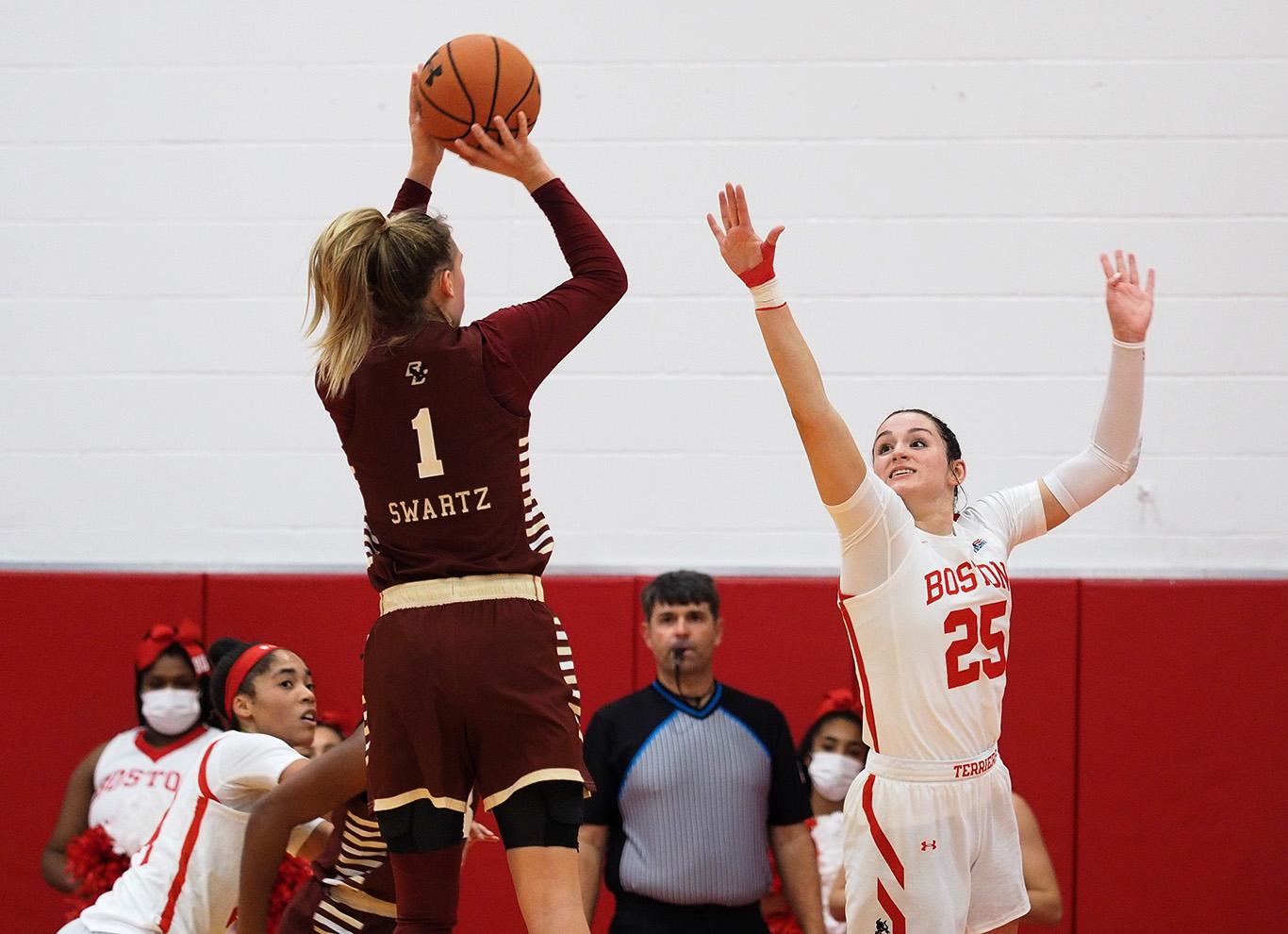 Senior forward Riley Childs attempts to block a shot in a match against Boston College Wednesday night. The Terriers sealed a 69-65 win over the Eagles. JEFF TEDI/ DAILY FREE PRESS STAFF
