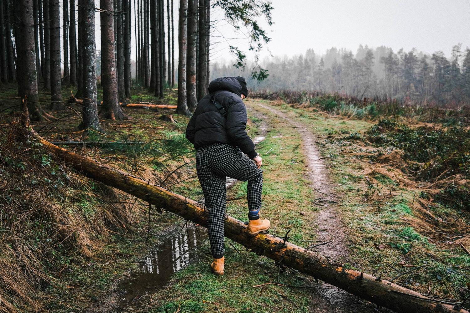 A person hiking on a rainy day. Samantha recommends several activities to keep you occupied during overcast skies and rainy weather. COURTESY OF JONAS VANDERMEIREN VIA UNSPLASH