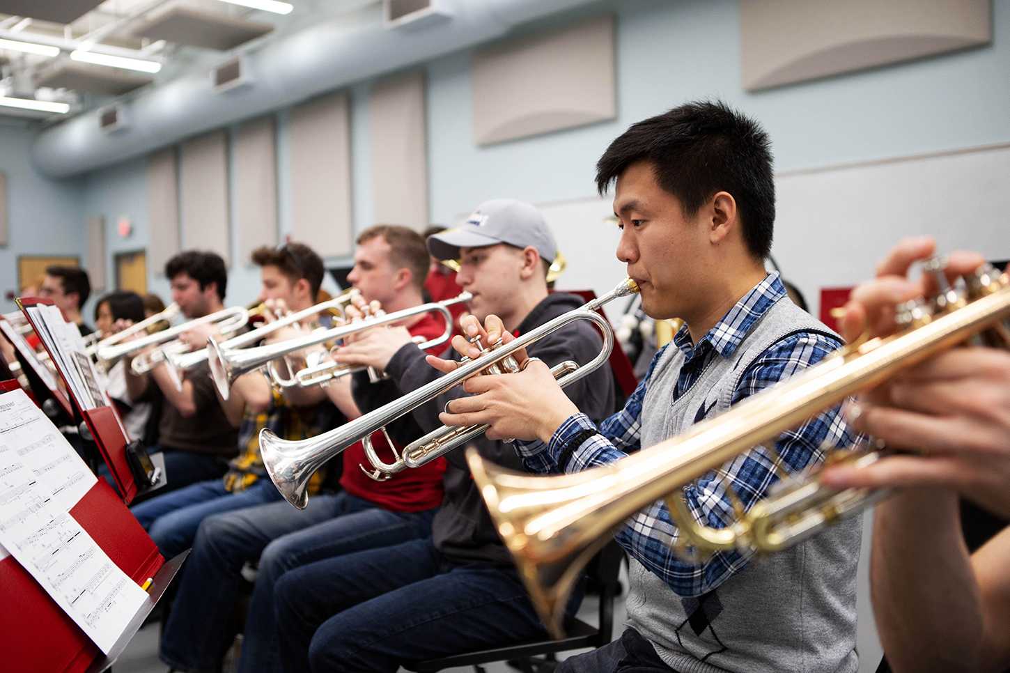 Students play their trumpets during a Boston University Concert Band practice. VIVIAN MYRON/ DFP STAFF

