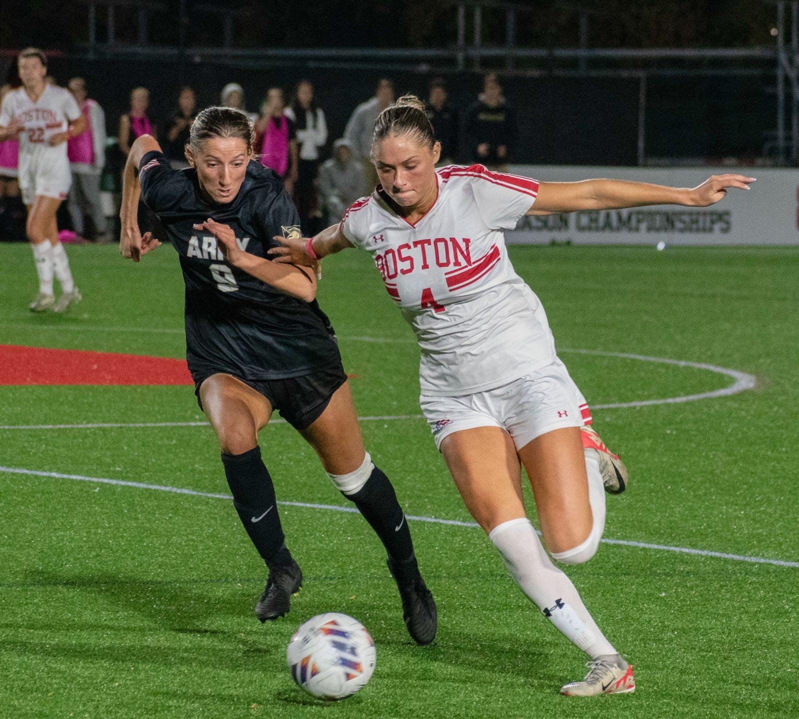 Boston University junior midfielder Mackenzie Stickleman (4) and Army West Point senior forward Grace Edvalds (9) fight for the ball in a game between the two universities on Wednesday. BU defeated Army 1-0, achieving the No. 2 seed in the Patriot League conference. JOHN DOWNES/DFP PHOTOGRAPHER