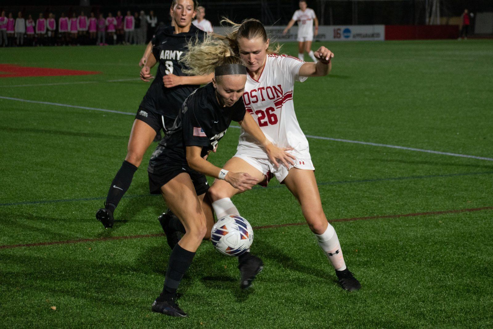 Senior defender Allison Hanlon (26) fights for possession of the ball with an Army West Point player during the game on Oct. 30. The Boston University women’s soccer team beat Army in the Patriot League semifinal on Thursday. JOHN DOWNES/DFP PHOTOGRAPHER 
