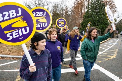 32BJ SEIU supporters march through Arnold Arboretum of Harvard University on Saturday. Negotiations between Harvard and the union have been ongoing since August. PHOTO COURTESY OF ANN HERMES/32BJ