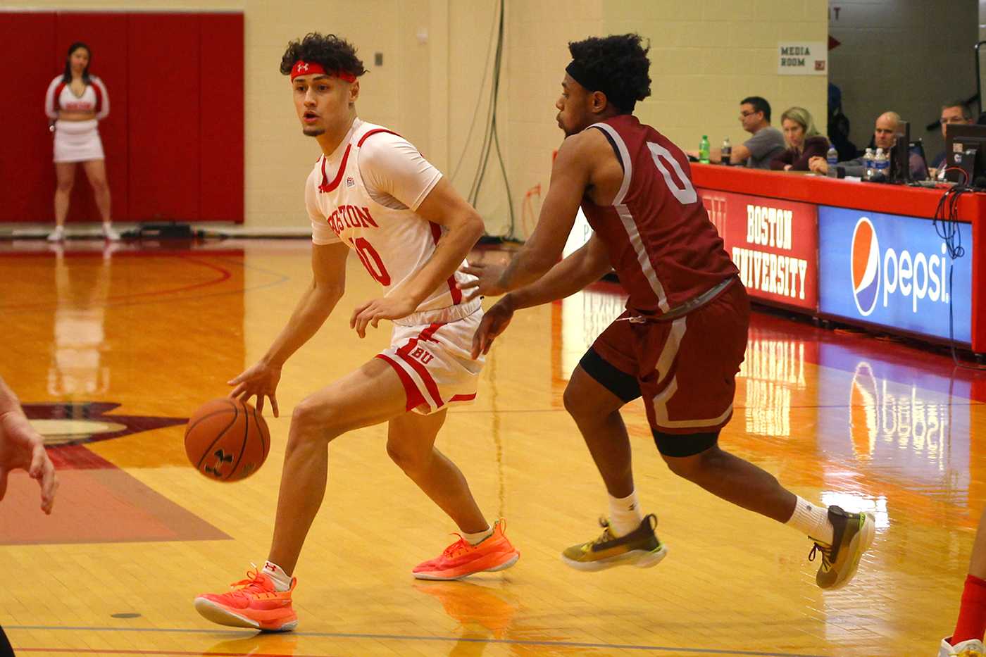 Javante McCoy dribbling against Jordan Burns