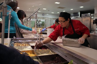 Boston University employees work in the Warren Towers dining hall Tuesday evening, despite inclement weather and transportation bans. PHOTO BY SARAH SILBIGER/DAILY FREE PRESS STAFF