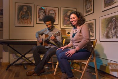 Two performers share the stage at Gallery 263 in Cambridge as they perform an original song about combating gender inequality during the Emerging Boston Area Singer-Songwriters open mic on Oct. 4. PHOTO BY RHIANNON JESELONIS/ DAILY FREE PRESS STAFF 