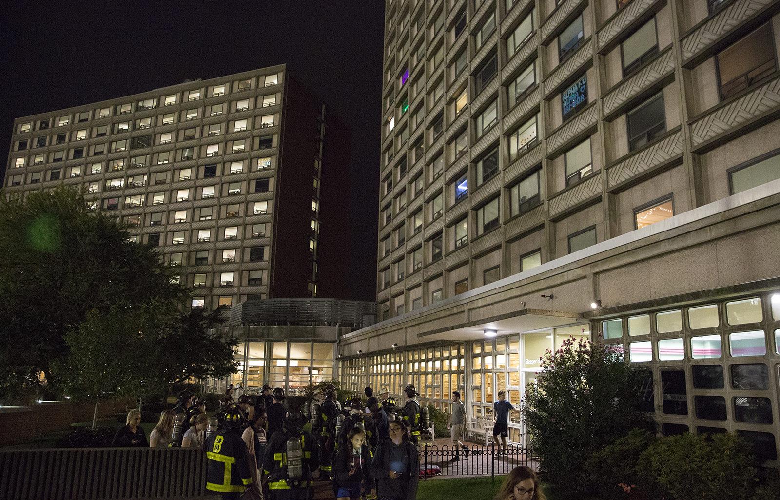 Boston University students in Sleeper Hall at 275 Babcock St. are evacuated Sunday night after a fire breaks out on the second floor. PHOTO BY SARAH SILBIGER/ DAILY FREE PRESS STAFF