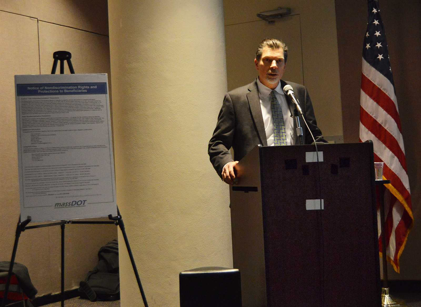 Charles Planck, Assistant General Manager of the Massachusetts Bay Transportation Authority, discusses the benefits and drawbacks of continuing late night public transportation services at a public meeting held Tuesday night. PHOTO BY ERIN BILLINGS/DAILY FREE PRESS STAFF