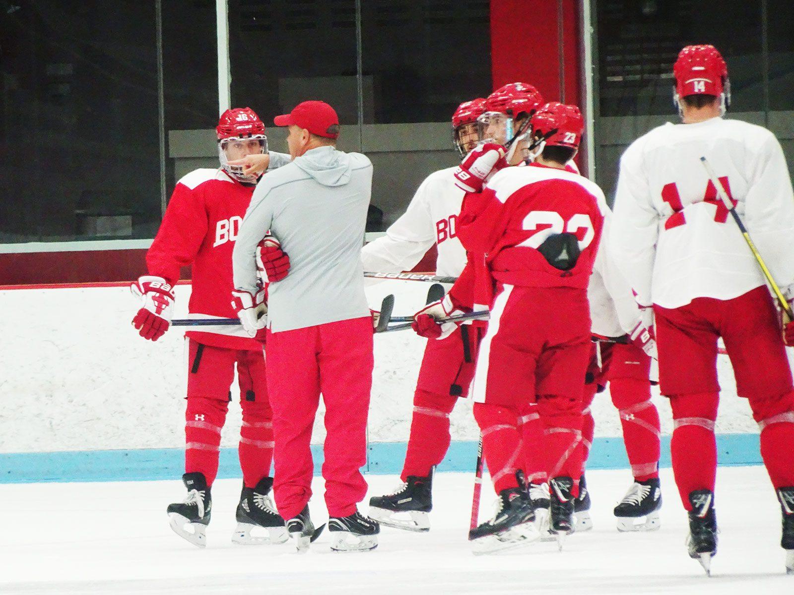 Associate head coach Paul Pearl directs drill at a pre  season practice