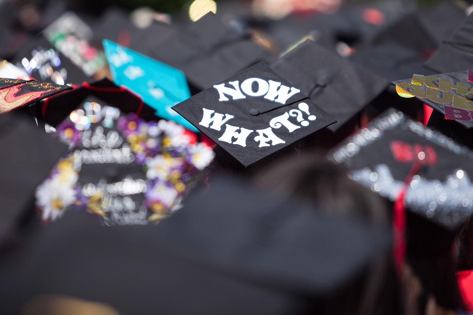 Graduates wear decorated caps during Boston University's All-University Commencement Ceremony for the graduating class of 2016. Boston University’s incoming and graduating students both say they feel uncertain about their future amidst the coronavirus outbreak. ALEXANDRA WIMLEY/ DFP FILE
