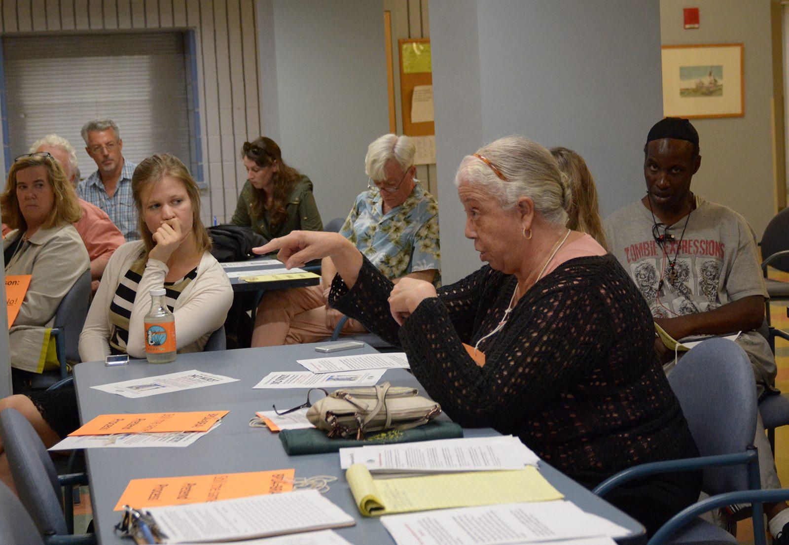 The Fenway Community Development Corporation holds a public meeting Monday evening to discuss stopping Emerson College and the Boston Planning and Development Agency from turning the hostel at 12 Hemenway St. into a dorm for students. PHOTO BY JESS RICHARDSON/ DAILY FREE PRESS STAFF STAFF