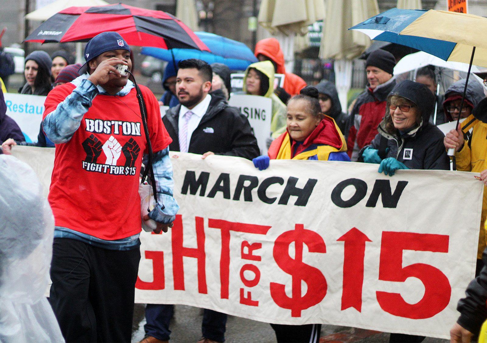 Locals gather Tuesday afternoon at Boston Common to march in commemoration of Martin Luther King Jr. and advocate for a $15 minimum wage. PHOTO BY FRANCHESCA VIAUD/ DAILY FREE PRESS STAFF
