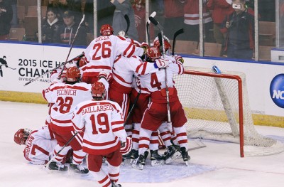 BU players celebrate after beating Minnesota Duluth in the Northeast Regional final. PHOTO BY MAYA DEVEREAUX/DAILY FREE PRESS STAFF