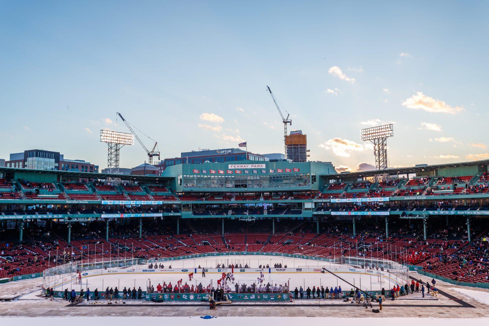BOSTON, MA - JANUARY 07: Teams face-off against the backdrop of historic Fenway during the third period of the game between the Boston University Terriers and the UMass Minutemen on January 8th, 2017, at Fenway Park in Boston, MA. (Photo by John Kavouris/Daily Free Press Staff)