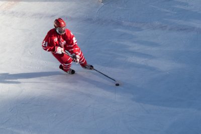 BOSTON, MA - JANUARY 07: Boston University Terriers forward Patrick Harper (21) during the first period of the game between the Boston University Terriers and the UMass Minutemen on January 8th, 2016, at Fenway Park in Boston, MA. (Photo by John Kavouris/Daily Free Press Staff)