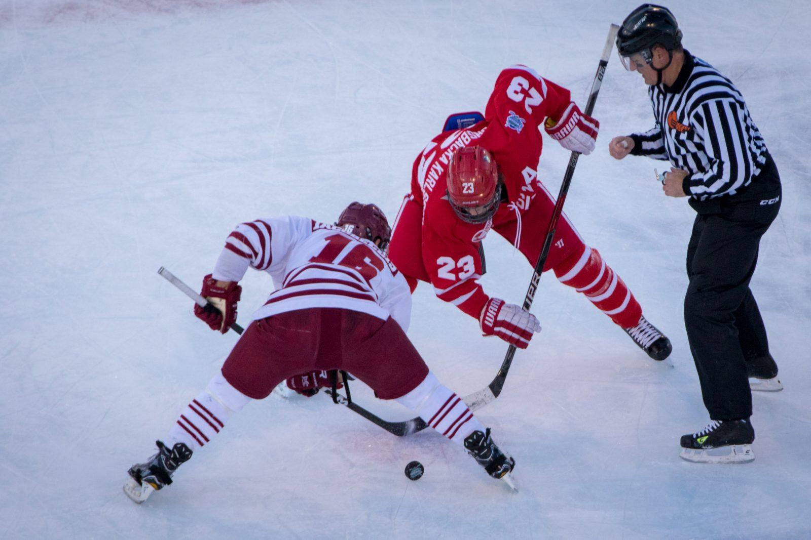 BOSTON, MA - JANUARY 07: Boston University Terriers forward Jakob Forsbacka Karlsson (23) faces off during the second period of the game between the Boston University Terriers and the UMass Minutemen on January 8th, 2017, at Fenway Park in Boston, MA. (Photo by John Kavouris/Daily Free Press Staff)