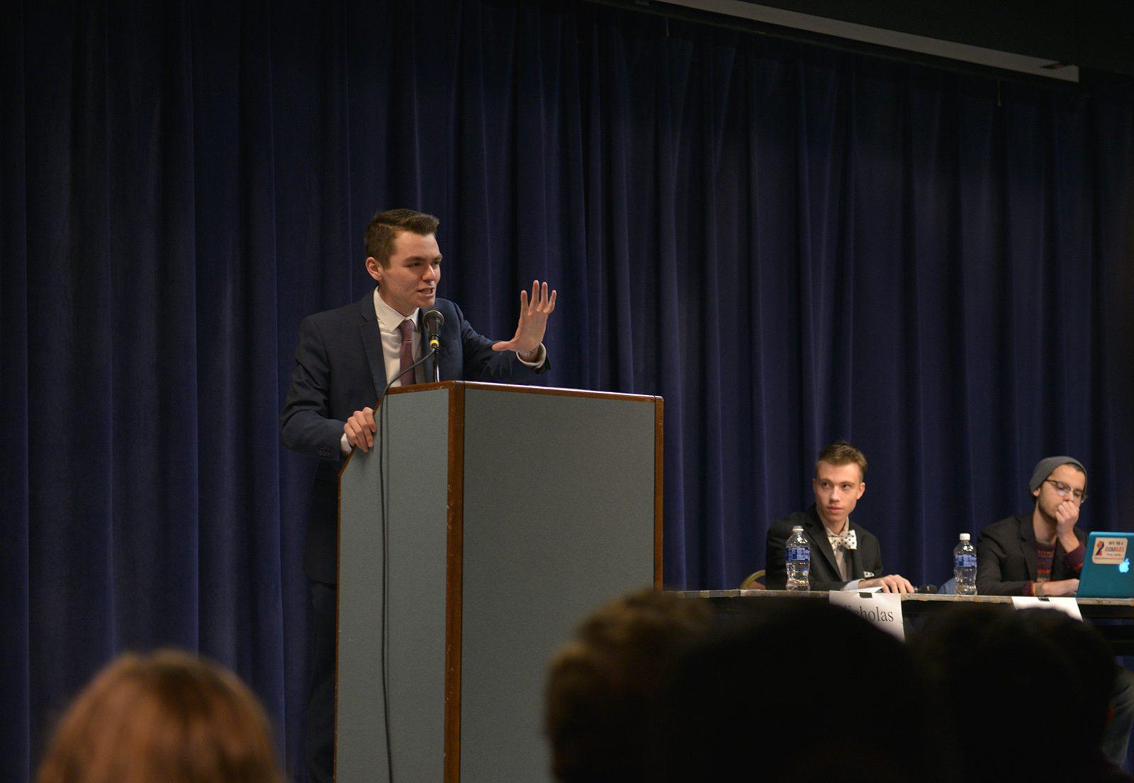 Nicholas Fuentes (CAS '20) makes his opening statement at the debate, which was organized following strong reactions to BU Today’s “Who I’ll Be Voting For” video series. PHOTO BY SHANE FU/ DAILY FREE PRESS STAFF 
