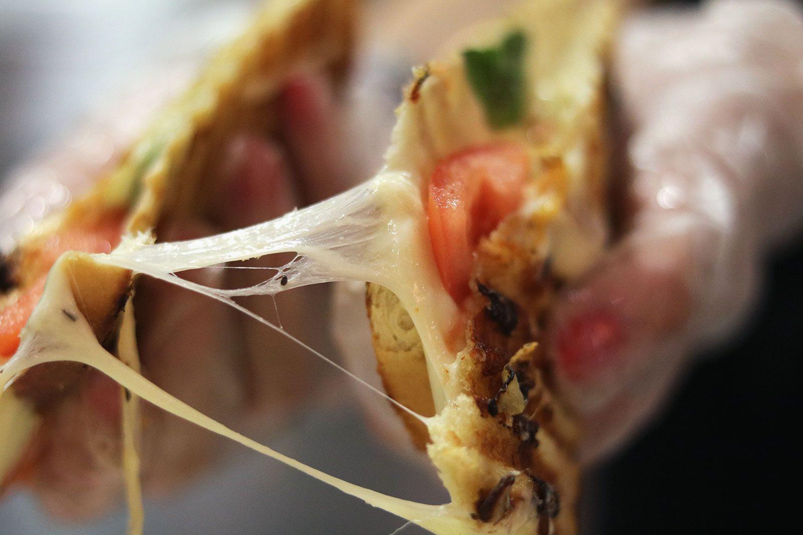 The caprese grilled cheese by FeelGood BU, a student-led food service that donates proceeds to the Commitment 2030 Fund. FeelGood is open on Tuesday nights at Warren Towers Late Nite Cafe. SOFIA KOYAMA/ DAILY FREE PRESS STAFF