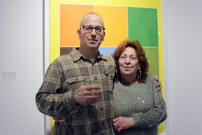 Artist David X. Levine (left) attends the premier of "The Beatles are Dull and Ordinary" at the Sherman Gallery Friday. PHOTO BY SARAH SILBIGER/DAILY FREE PRESS STAFF