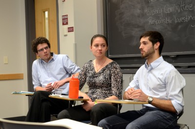 Ben Thompson, a second-year student in the Graduate School of Arts and Sciences and a graduate representative for ACSRI, Claire Richer, an undergraduate representative (CAS ’15), and Garrett Moore, an undergraduate representative (ENG ’15) host a town hall meeting about fossil fuel divestment in the Boston University Photonics Center Wednesday. PHOTO BY DANIEL GUAN/DAILY FREE PRESS STAFF