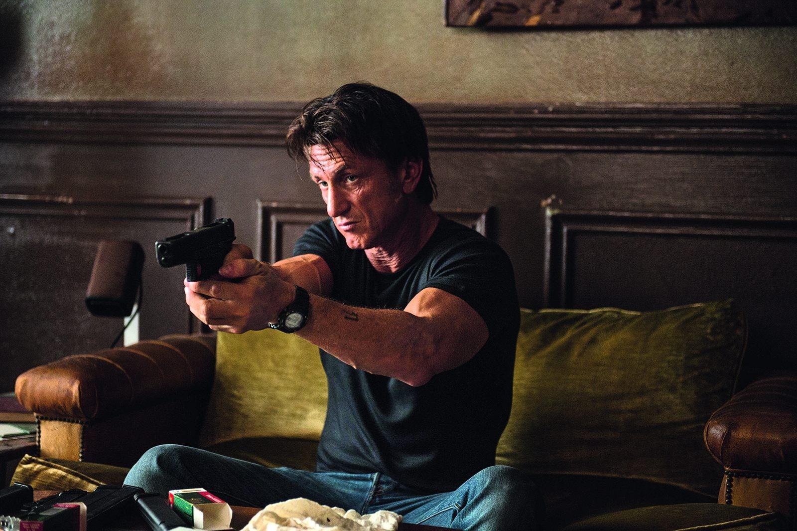 Sean Penn is Jim Terrier in “The Gunman”, which opened Friday. PHOTO COURTESY OF JOE ALBLAS/OPEN ROAD FILMS
