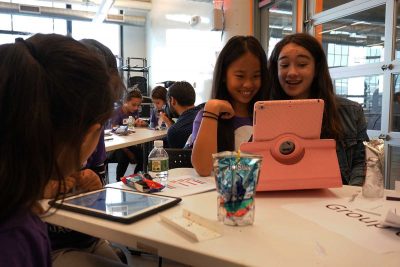 Two young girls, Julie and Marlie, enjoy the game they created at the HUBweek Girl Hackathon event. PHOTO BY JUNE KIM/ DAILY FREE PRESS CONTRIBUTOR