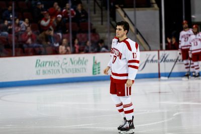 BOSTON, MA - JANUARY 13: Boston University Terriers defenseman Dante Fabbro (17) and other players who competed in the recent World Junior Hockey Championships were honored before the game between the Boston College Eagles and the Boston University Terriers on January 13th, 2016 at Agganis Arena in Boston, MA. (Photo by John Kavouris/Daily Free Press Staff)