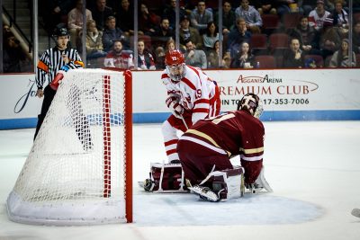 BOSTON, MA - JANUARY 13: Boston University Terriers forward Clayton Keller (19) fights with Boston College Eagles goaltender Joseph Woll (31) for the puck during the first period of the game between the Boston College Eagles and the Boston University Terriers on January 13th, 2016 at Agganis Arena in Boston, MA. (Photo by John Kavouris/Daily Free Press Staff)