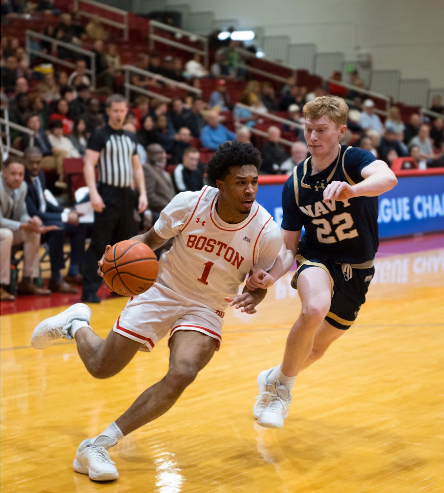 Junior guard Ethan Okwuosa (1) drives to the basket in a game against Navy on Thursday. The Terriers beat the Midshipmen 70-61, advancing to the Patriot League semifinals. MOLLY POTTER/DFP PHOTOGRAPHER