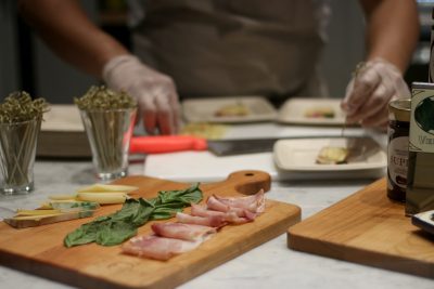 A chef prepares a tray of food at Eataly Boston, an Italian marketplace, which opens at the Prudential Center on Nov. 29. BETSEY GOLDWASSER/ DAILY FREE PRESS STAFF