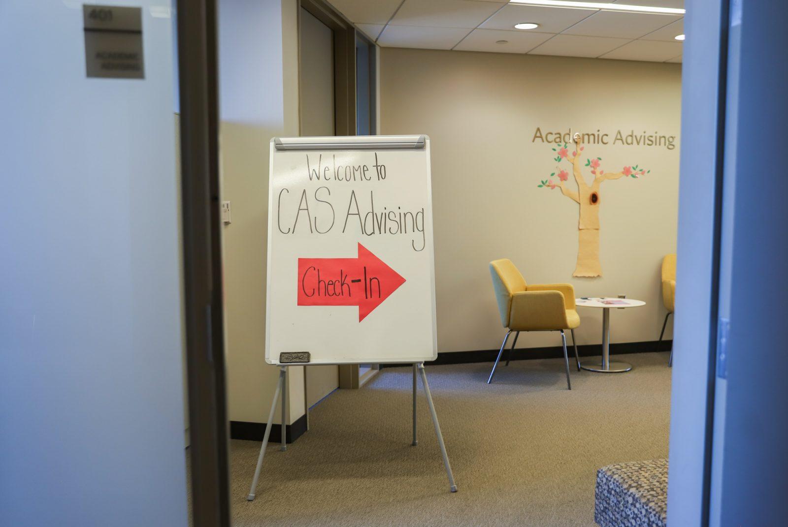 A sign pointing to CAS Advising, which is located inside the Yawkey Center for Student Services. There is currently a shortage of advisors in Boston University’s Department of Computer Science due to two advisors leaving for new positions and another going on leave. KATE KOTLYAR/DFP PHOTOGRAPHER 