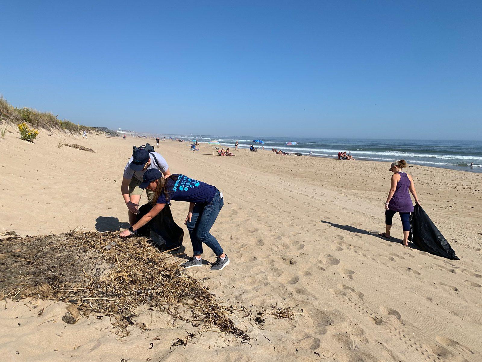 Volunteers with COASTSWEEP, an annual Massachusetts beach cleanup, pick up trash at the Salisbury Beach State Reservation on Saturday. COURTESY OF THE MASSACHUSETTS OFFICE OF COASTAL ZONE MANAGEMENT