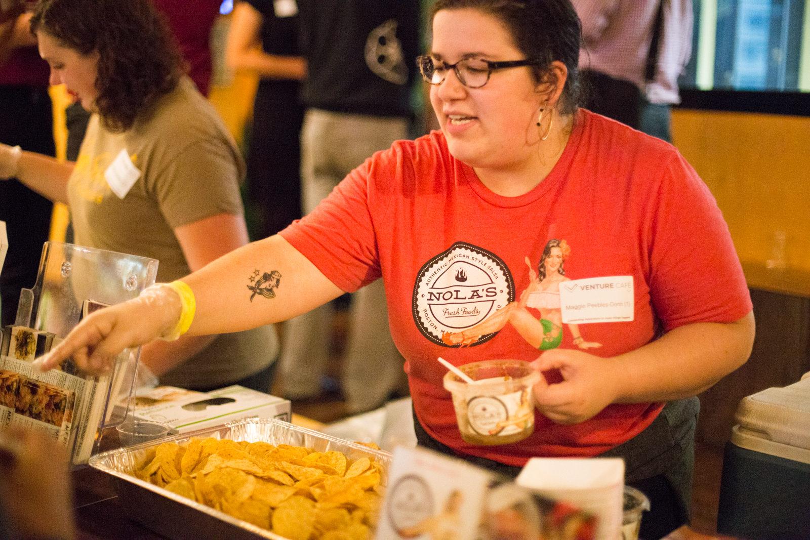 Nola's gives out samples Thursday at FoodBev Connect: Boston’s Recipe for Food Innovation. PHOTO BY PAIGE WARD/ DAILY FREE PRESS STAFF