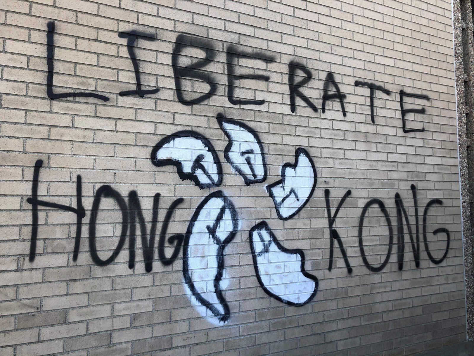 “Liberate Hong Kong” was spray-painted on Warren Towers with a white flower on Friday. VICTORIA BOND/DAILY FREE PRESS STAFF