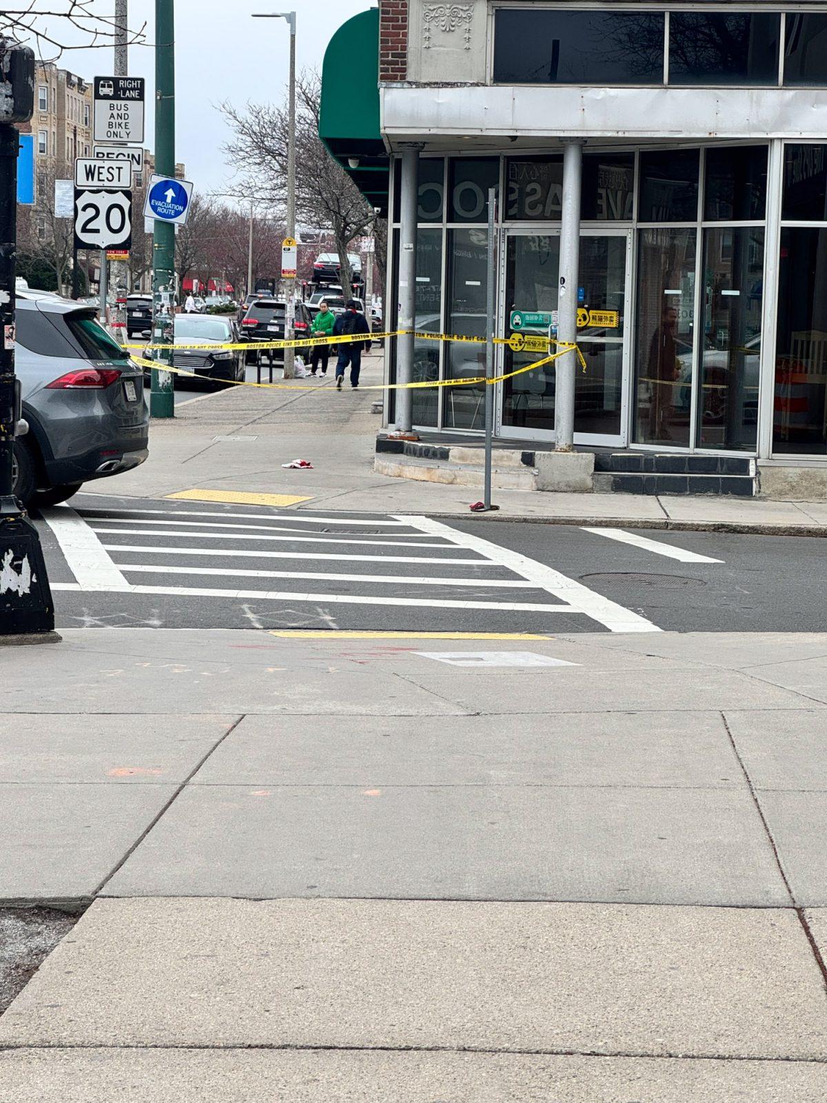 Police tape outside of Hong Kong Supermarket in Allston. A man was stabbed outside of the market Monday morning. COURTESY OF OWEN LENNOX
