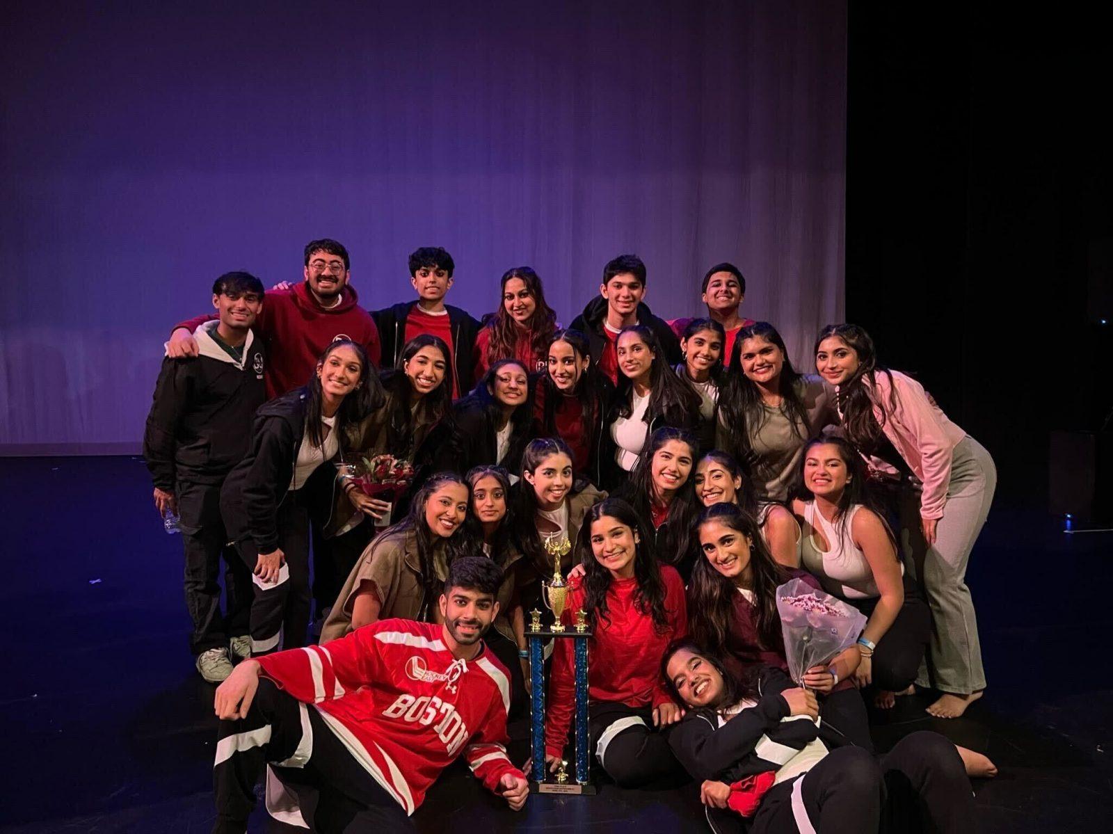 Members of Boston University’s Jalwa dance team pose with their trophy at the South Asian Showdown at Strand Theatre on Saturday. The team won third place for their performance based on the 2019 film “Escape Room.” COURTESY OF ANISHA PATEL