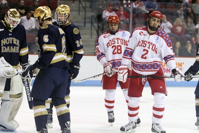 J.J. Piccinich (28) and Ahti Oksanen (2) show disappointment during BU's 3-2 loss to Notre Dame. PHOTO BY MAYA DEVEREAUX/DAILY FREE PRESS STAFF