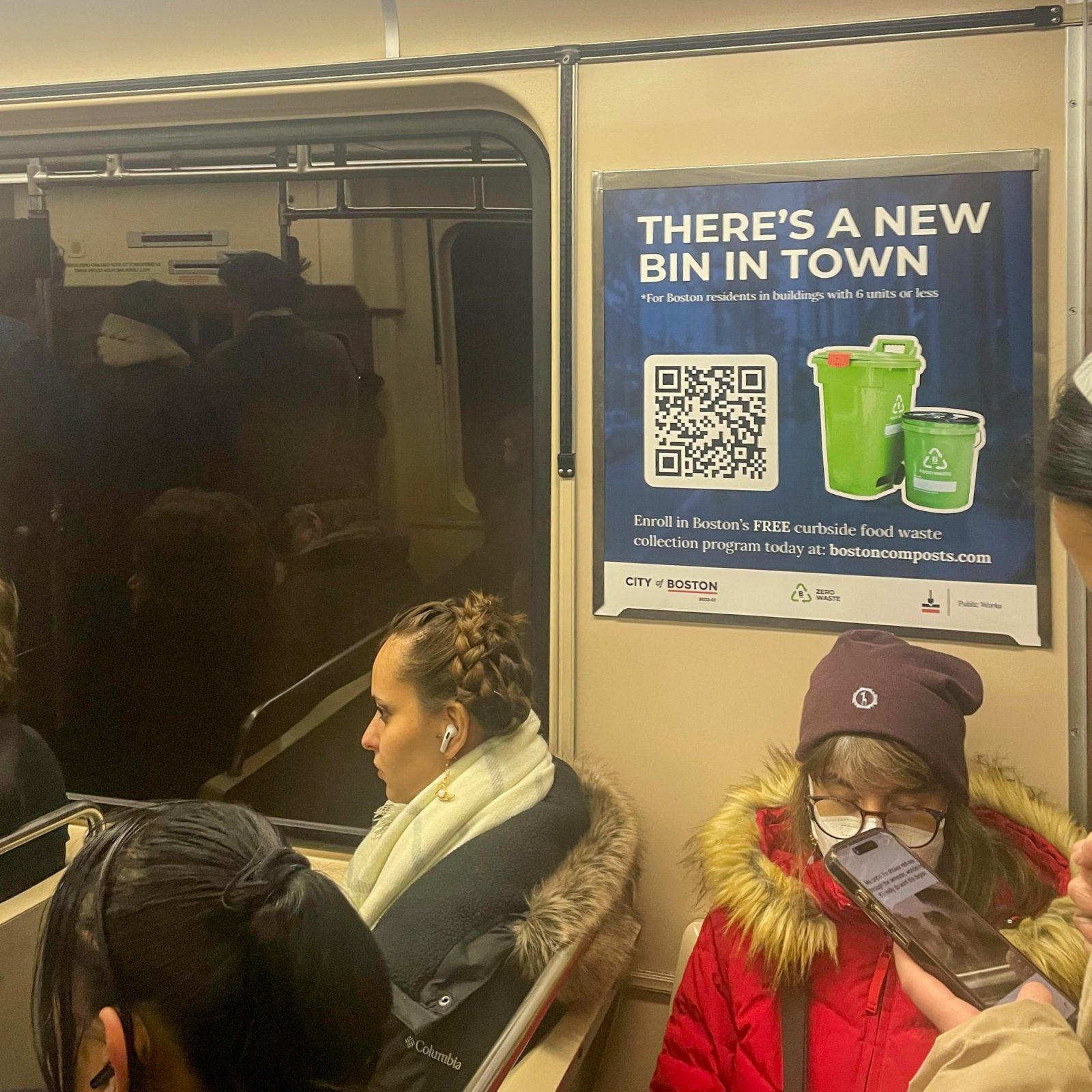 An advertisement for Garbage to Garden, Inc.’s free food waste collection program is displayed on the T. The program is increasing its advertising and outreach efforts to increase participation in the service. PHOTO BY ALEXANDRA RUANE
