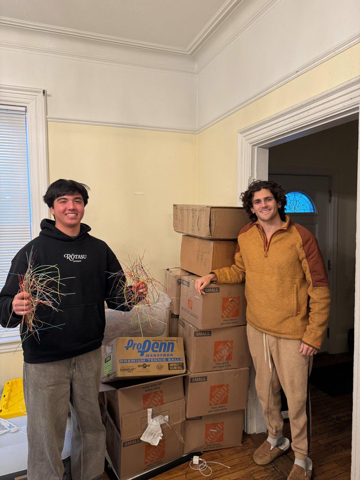 Orobor founders and Boston University tennis players Jakob Esterowitz (left) and Jonah Dickson (right) pose with tennis strings they collected. The company converts used tennis strings into recycled polyester suitable for clothing manufacturing. COURTESY OF JAKOB ESTEROWITZ 