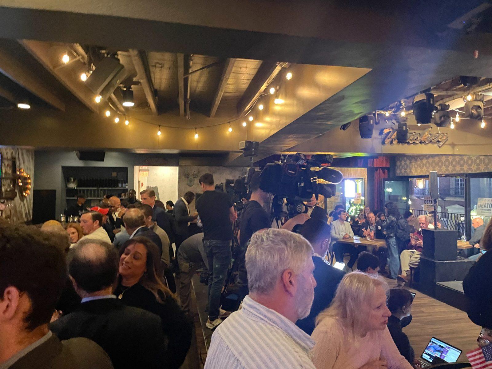 People attending John Deaton’s Election Night Party at Nash Bar and Stage on Tuesday. Local political groups across Boston hosted election watch parties on Tuesday. PHOTO BY AVA BERGER