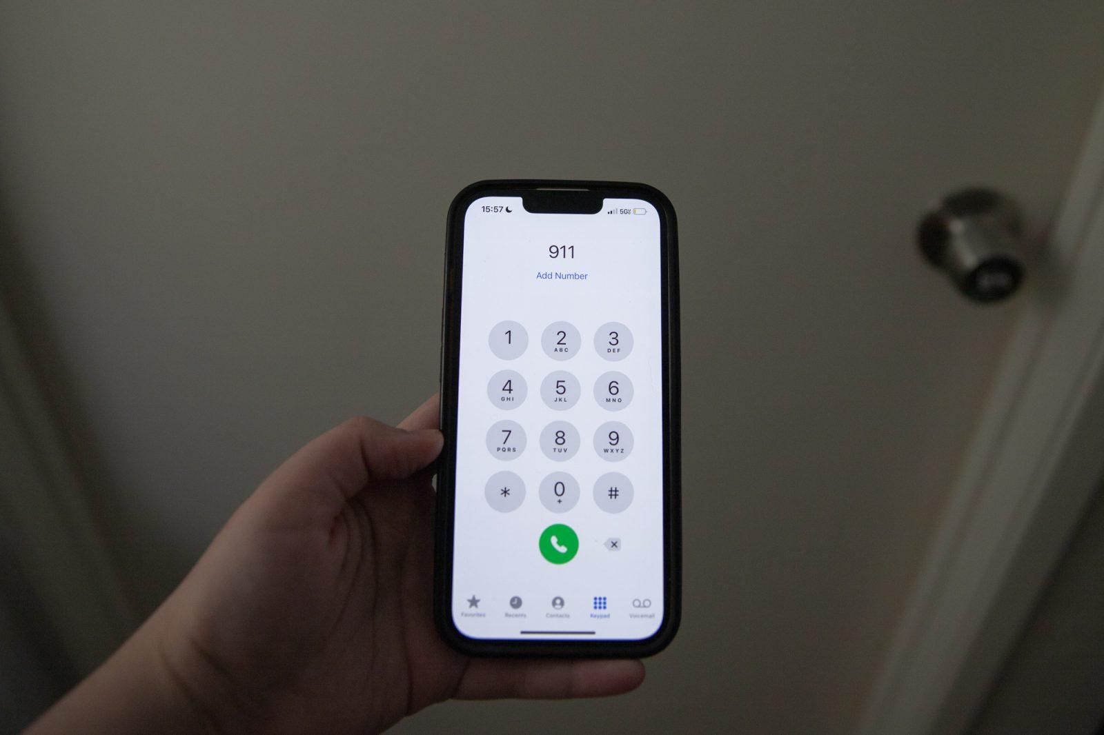 A smartphone dials 911. Massachusetts experienced a statewide 911 system outage for about two hours on Tuesday afternoon. KATE KOTLYAR/DFP PHOTOGRAPHER