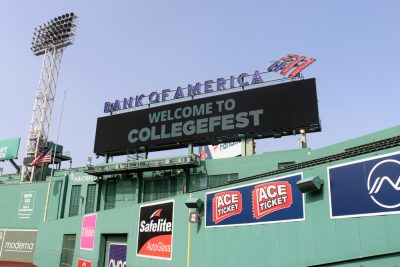 A billboard welcoming students to CollegeFest at Fenway Park