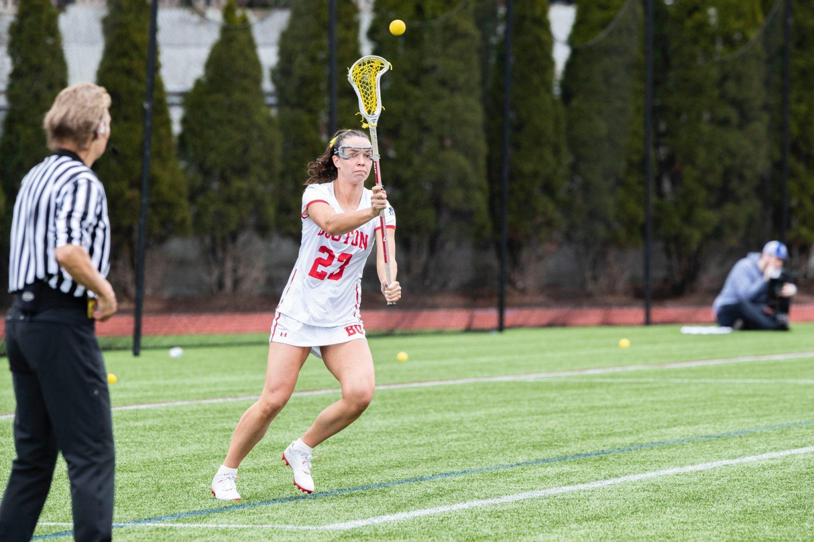 Then-junior attack Hannah Tiller (23) goes to catch the ball during a game against Colgate University on Apr. 17, 2024. The Boston University women’s lacrosse team falls 21-6 to Boston College on Sunday afternoon at Nickerson Field. COURTESY OF MATT WOOLVERTON/BU ATHLETICS  