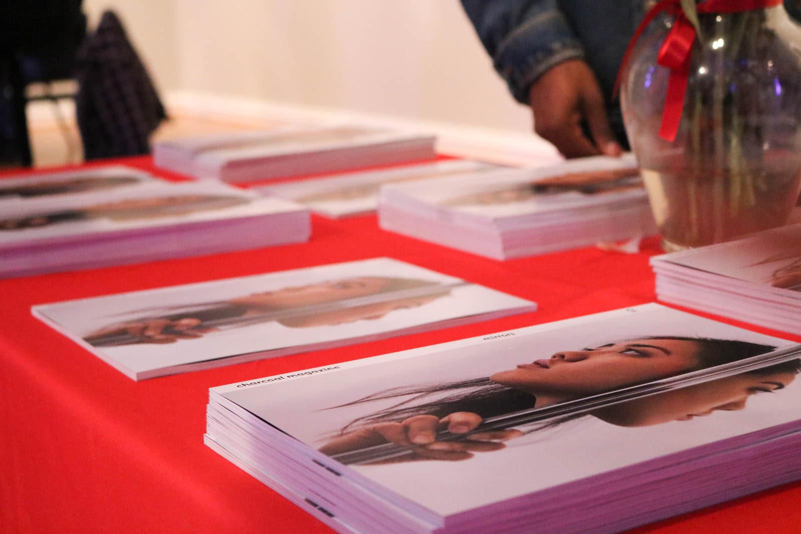 Copies of Charcoal Magazine at its launch in CFA on Saturday. PHOTO BY JACOB WITTENBERG/ DAILY FREE PRESS STAFF