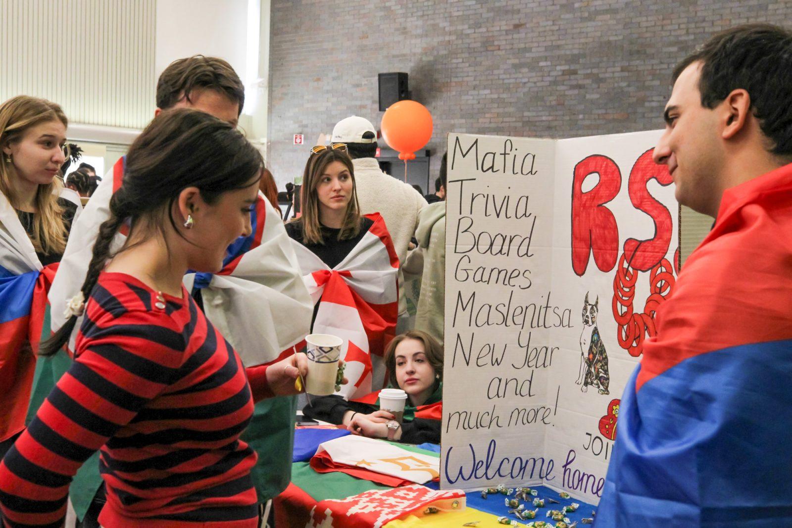 Members of the Russian-Speaking Society at Boston University talk to a prospective member at their table at Splash 2.0. SARAH CRUZ/DFP PHOTOGRAPHER