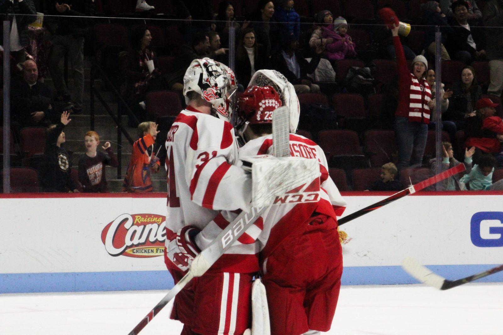 Sam Tucker and Dom Fensore celebrate Boston University’s win over the University of Vermont. JENNA VANSICKLE/ DAILY FREE PRESS STAFF
