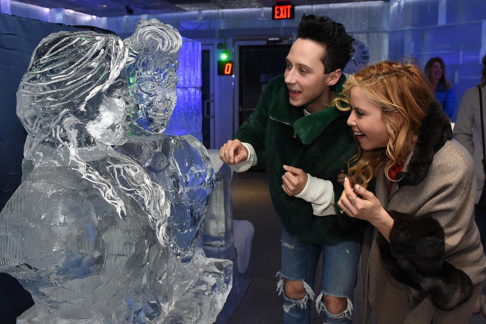 Tara Lipinski and Johnny Weir react to the ice sculptures modeled after them. PHOTO COURTESY BRIAN BABINEAU/TD GARDEN
