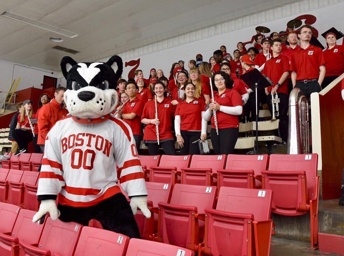 Boston University mascot Rhett the Terrier poses alongside the BU Pep Band. Arcangelo Cella, the BU alumnus who created a petition to rename Rhett, was denied a place on the committee designated to consider the name change. COURTESY OF MITCH DAVIDOWITZ FOR BU BANDS
