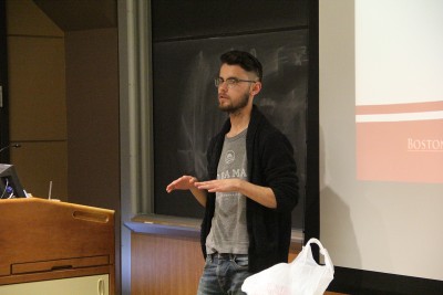 Jake Brewer, a junior in the College of Arts and Sciences and BU Student Government's president-elect, presents his amendment to create an upper and lower house at a Senate meeting Wednesday evening. PHOTO BY SOFIA FARENTINOS/DAILY FREE PRESS STAFF