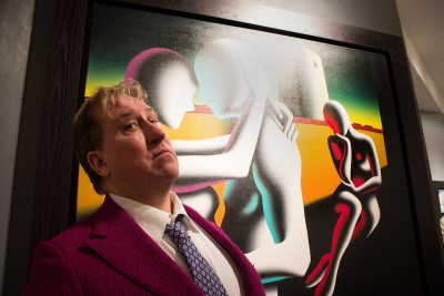 Artist Mark Kostabi poses with his painting at his solo exhibition opening in the Martin Lawrence Gallery Friday night. PHOTO BY KANKANIT WIRIYASAJJA/DAILY FREE PRESS STAFF 