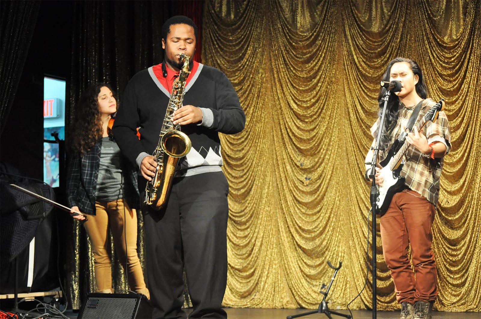 Ritchy Lamarre of the “The Sunset Kings” performs at Club Cafe Saturday afternoon to protect and further LGBTQ rights. PHOTO BY BRIANNA BURNS/ DAILY FREE PRESS STAFF